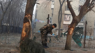 Afghan security forces inspect the site of the suicide attack in Kabul. Omar Sobhani / Reuters