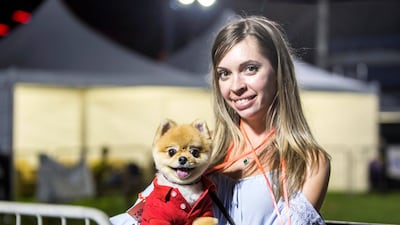 A proud pet owner at the Yas Pet Together.