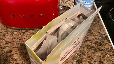 Tuck the inside flaps into the box, apart from the front one with the protruding tag.