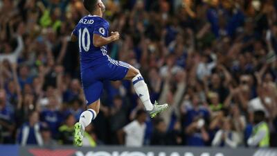Chelsea midfielder Eden Hazard celebrates after scoring the opening goal from the penalty spot during the Premier League football match between Chelsea and West Ham United at Stamford Bridge in London on August 15, 2016. Justin Tallis / AFP