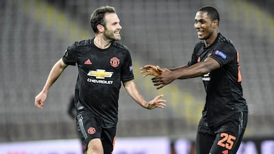 Juan Mata, left, celebrates with Ighalo after scoring the third goal. AP