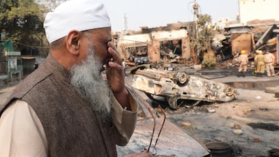 Indian Muslim man Abdul Hafiz reacts as he looks at the brunt Tyre market near Gokulpuri metro station after clashes in New Delhi, India. EPA