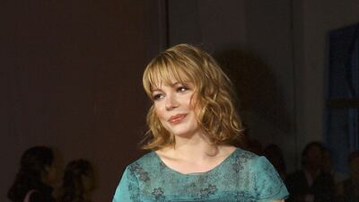 In a metallic turquoise dress and brown tights at the 'Land of Plenty' premiere at the 61st Venice Film Festival on September 9, 2004 in Venice, Italy. Getty Images