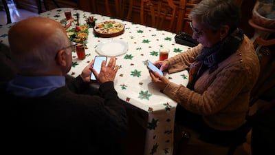 Iranians living in Barcelona try to contact relatives back in Iran during the protests. Reuters