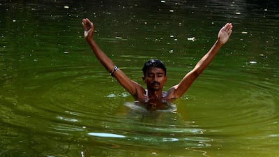Hindu devotee Hansraj Kothi immerses himself in the Ganga Pond, which is considered sacred by Pakistani Hindus in the area of Sardhra Nagarparkar. Washing oneself in the water is considered a way for devotees to cleanse their sins. Mobeen Ansari