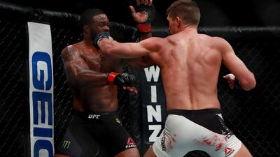 Tyron Woodley of the United States, right, fights against Stephen Thompson of the United States in their welterweight championship bout. Woodley thought he had seen off Thompson to claim a narrow split decision, but the result initially announced in the octagon was corrected after several minutes and changed to a majority draw. . Michael Reaves / Getty Images