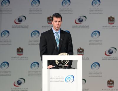 Prof Eric Frew accepts his award at the UAE Research Programme for Rain Enhancement Science ceremony in 2018. He won for his pioneering work on drones and cloud seeding. Chris Whiteoak / The National