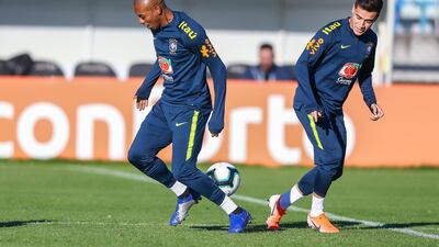 Brazil midfielders Fernandinho and Philippe Coutinho take part in a training session. Getty Images