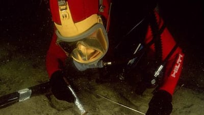 An archaeologist diver excavates a site at Canopus, Aboukir Bay. Christoph Gerigk / Franck Goddio / Hilti Foundation