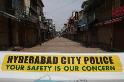 A signage is displayed at a closed market during a lockdown imposed to curb the spread of the coronavirus in Hyderabad, India.. AP Photo/Mahesh Kumar A.