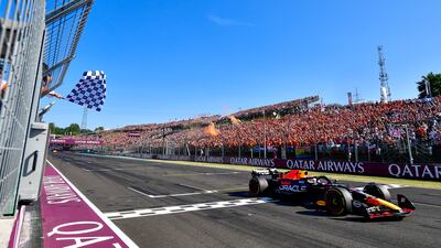 Dutch driver Max Verstappen takes the chequered flag to win the race. AP