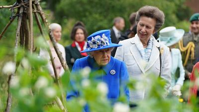 Queen Elizabeth and Princess Anne visit the Children's Wood Project, a community project in Glasgow, as part of her traditional trip to Scotland for Holyrood Week in 2021.