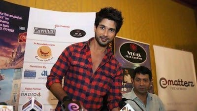 Bollywood actor Shahid Kapoor and film director Kunal Kohli greet the media during a press conference yesterday.