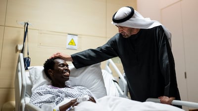President Sheikh Mohamed visits a patient injured in Iran's recent attacks on the UAE. Abdulla Al Bedwawi / UAE Presidential Court