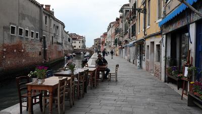 A Venetian sits outside the historical cafe called 'The lost Paradise' at the fondamenta della Misericordia in Venice, Italy. Getty Images