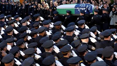 Police officers carry the coffin of New York City police officer Rafael Ramos following his funeral at Christ Tabernacle Church in Glendale, New York, on 27 December, 2014. Justin Lane/EPA