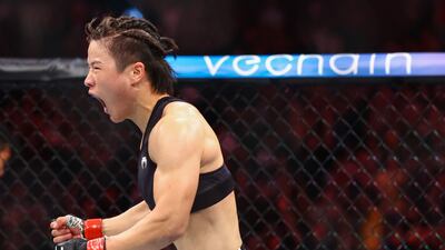 Zhang Weili celebrates after defeating Joanna Jedrzejcyk by knockout in their women's strawweight fight at UFC 275 at Singapore Indoor Stadium on June 12, 2022 in Singapore. Getty. Getty