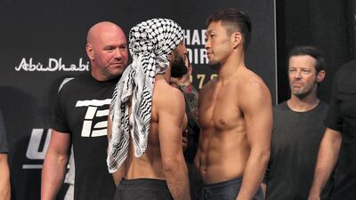 Belal Muhammad, left, and Takashi Satō square off.