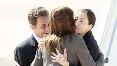 The former hostage Ingrid Betancourt, right, is welcomed by French President Nicolas Sarkozy and his wife Carla Bruni-Sarkozy as she arrives at Villacoublay air base, outside Paris.