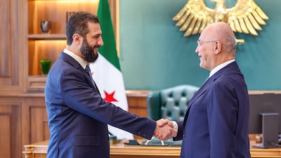 Syrian President Ahmad Al Sharaa, left, and UN High Commissioner for Refugees Barham Salih at the People’s Palace in Damascus on August 10. AFP