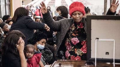 Relatives of Njabulo Allen Dlamini (31) a father of 11, taxi driver killed in Phoenix, Durban, on July 12 allegedly by a group of South African Indians resident manning a roadblock while defending their properties from looters mourn on July 21, 2021 at his funeral service.
