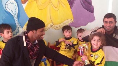 Salem Alkarbi hosts events for disadvantaged children worldwide through his football charity "Beyond the Boundaries of Football". Here he is in Armenia. Courtesy Salem Alkarbi