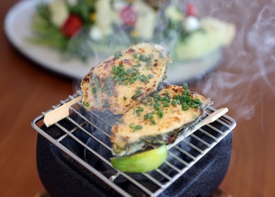 Baked oysters – Dibba Bay Oysters with bechamel sauce, topped with a chive crumble – by Emirati chef Faisal Al Harmoodi. Chris Whiteoak / The National