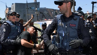 Police officers intervene after a fight broke out between Invasion Day protesters and two far right activists. EPA