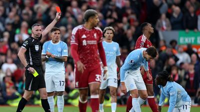 Liverpool's Ryan Gravenberch is shown a red card by referee Chris Kavanagh. Getty Images