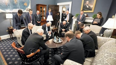 Mike Pence prays with the coronavirus task force. Critics noted that prayer would not stop the virus and the only effective defence strategy requires scientific and medical expertise.
