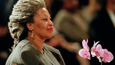Morrison holds an orchid at the Cathedral of St John the Divine in New York. AP Photo