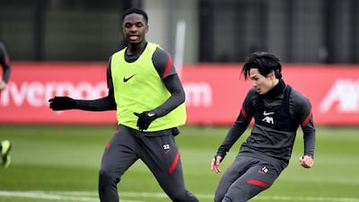 Takumi Minamino and Billy Koumetio at the AXA Training Centre. Getty