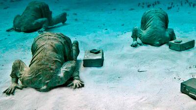 Some of the hundreds of sculptures at Cancun Underwater Museum. Photo: Musa