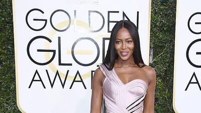 Naomi Campbell stunned in a gorgeous gown from Atelier Versace’s fall 2016 runway collection. The elaborate pearl pink gown had a ribbonlike construction, with an asymmetrical neckline and exaggerated hip detail. Courtesy of Versace