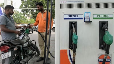 An attendant refuels petrol in a motorcycle at an Indian Oil fuel station in Amritsar in India. AFP