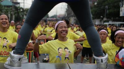 Filipinos smile while they follow steps during a Zumba class in an attempt to break a Guinness world record in suburban Mandaluyong, east of Manila, Philippines on Sunday, July 19, 2015. Guinness representative Alan Pixley announced that Mandaluyong city in the Philippines now holds the new world record for the title largest Zumba class with a total participant of 12,975. Aaron Favila / AP photo