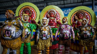 Pulikali or tiger dance artists before the Athachamayam procession in Kochi. AP