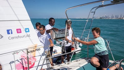 Marie Byrne tries out the new floating Carrefour mini market off the coast of Dubai. Antonie Robertson/The National