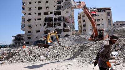 Excavators provided by Egypt help clear the rubble in Gaza City. AFP