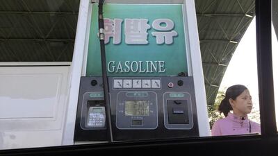 A gas attendant waits by a pump at a gas station in Pyongyang, North Korea on April 26, 2017 as petrol sales in the capital have been restricted for about a week with no official explanation, raising concerns over when the situation will return to normal. Eric Talmadge/AP Photo