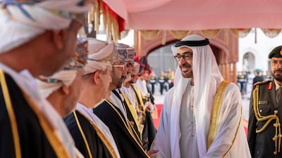 President Sheikh Mohamed greets a member of the Omani delegation at Al Alam Palace. Photo: UAE Presidential Court