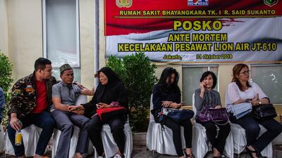 Families await news of those aboard the plane. Getty Images