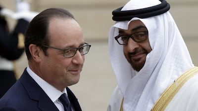 President Hollande welcomes the Abu Dhabi Crown Prince outside the Elysee Palace in Paris. Philippe Wojazer / Reuters