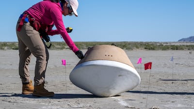 Nasa's recovery teams in August rehearsing before the capsule's landing attempt in a Utah desert on September 24. Nasa via AP