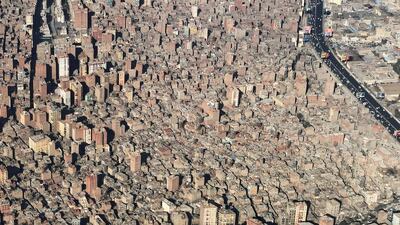 A view from an airplane window shows buildings in an area of dense population in Cairo, Egypt. REUTERS