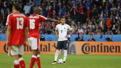 France midfielder Dimitri Payet lines up a free kick in the final stages of the match. Pascal Rossignol / Reuters