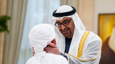 Sheikh Mohamed greets a guest at the Eid reception