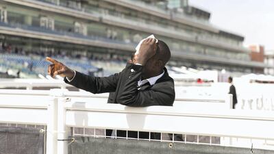 A security guard holds a white cloth to his head at Dubai World Cup 2018. Reem Mohammed / The National