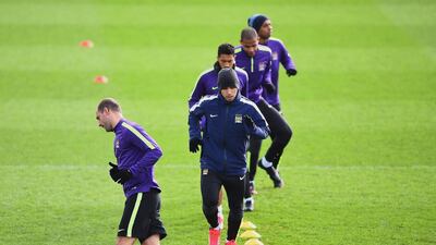 Pablo Zabaleta and Sergio Aguero of Manchester City run drills during Monday's team training session for the Champions League. Laurence Griffiths / Getty Images