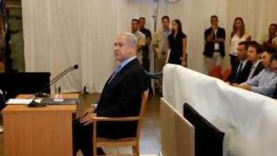 Israel's prime minister Benjamin Netanyahu sits before testifying in front of a state-appointed inquiry commission into the Israeli naval raid on a Gaza aid flotilla, in Jerusalem yesterday.